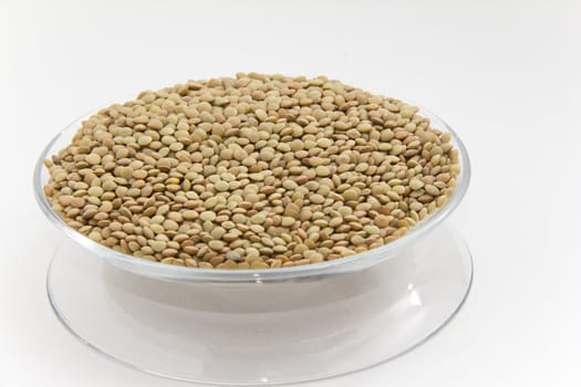 Green split peas on a clear plate with with background