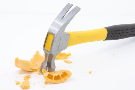 A hammer breaking an ice cream cone representing the use of excessive force