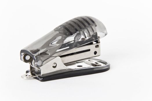 A single dark gray stapler on a white background