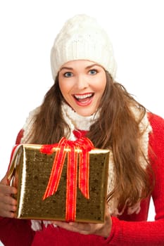 A beautiful young woman smiling and holding a golden christmas present