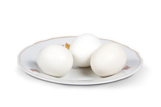 Boiled white eggs on a plate. Isolated on white with clipping path