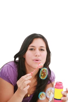 Young woman portrait making soap bubbles.