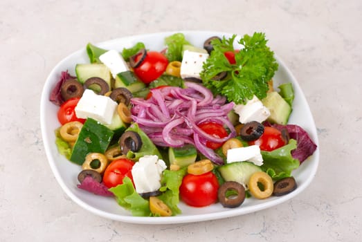 greece salad at plate isolated on a white