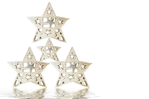 Christmas tree made up of four silver stars on white background