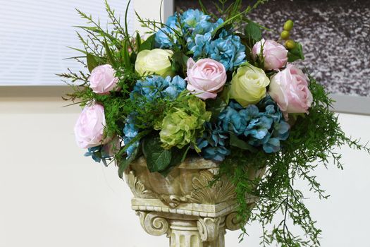 Beauty in nature - boquet of flowers in a roman design base.

