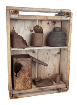 Old wooden shelves with rusty cans on white background