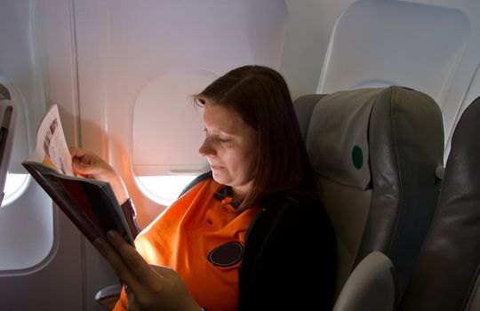 airplane woman passanger during a flight