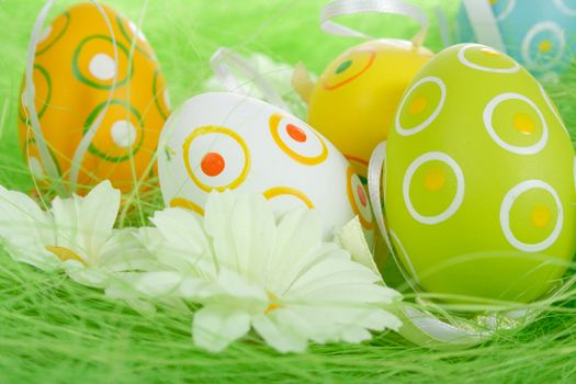 Painted Colorful Easter Eggs on green Grass