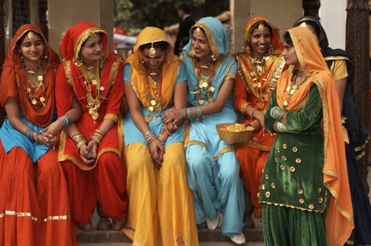 Group of colorfully dressed Indian ladies at the annual Surajkund Fair in Haryana, India