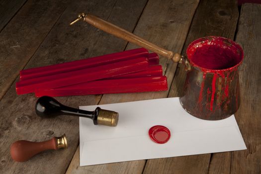 Red wax staff with stamp, pot and letter