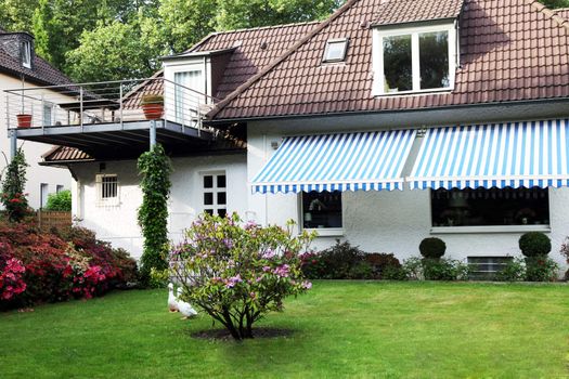 House or villa with garden - landscape format