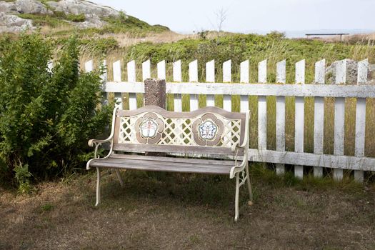 Empty wooden bench  on a sunny day 