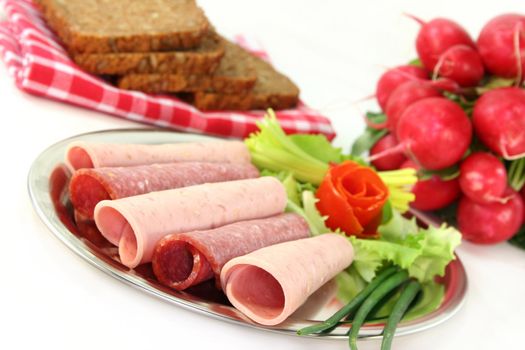 Salami and beer sausage with fresh vegetables