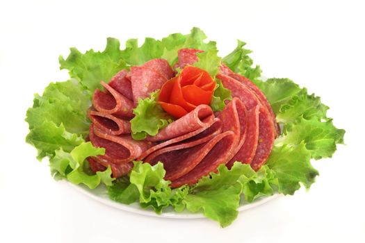 a plate of salami and garnish