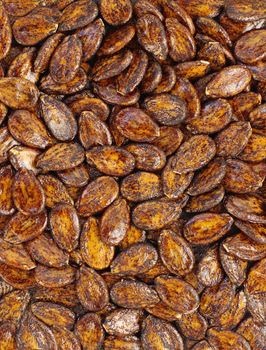 cumulate natural melon seeds close up as background