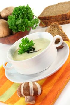 a bowl of Cream of mushroom soup with fresh ingredients