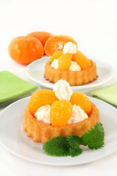 Mandarin cake with cream and lemon balm