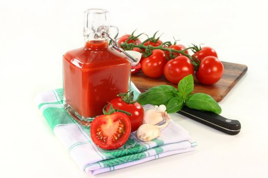 a bottle of tomato ketchup with fresh ingredients