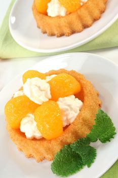 Mandarin cake with cream and lemon balm