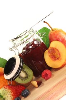 Fruit marmalade with different fruits on a wooden board