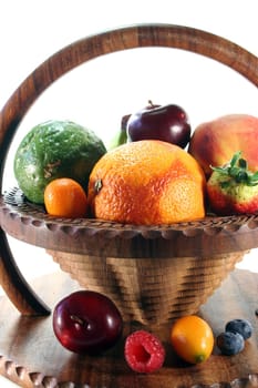 Mix of native and exotic fruits in a wooden basket