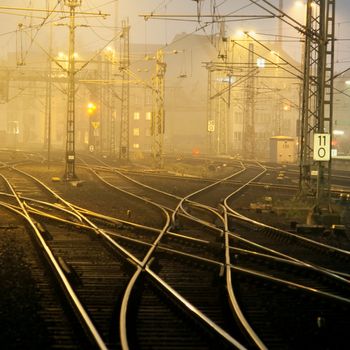 Confusing railway tracks near central station at night.