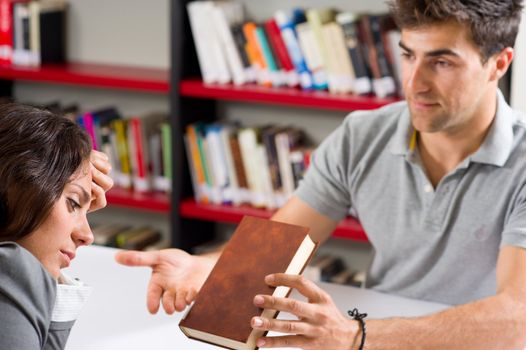 Guy trying to motivate his girlfriend to keep on with her studies