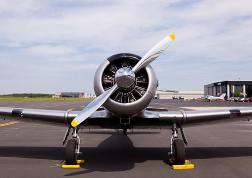 AT-6 Texan, known as the Harvard training plane on runway