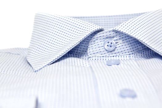 picture of a nicly folded men shirt with focus on the collars