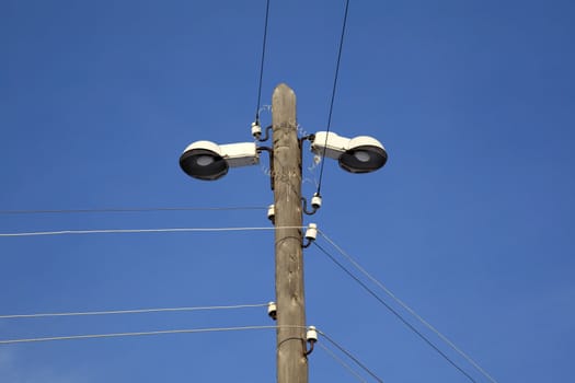 Street lighting. Village. Against the blue sky