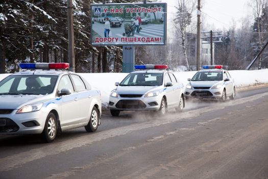 Police cars on the highway. Photography in motion.