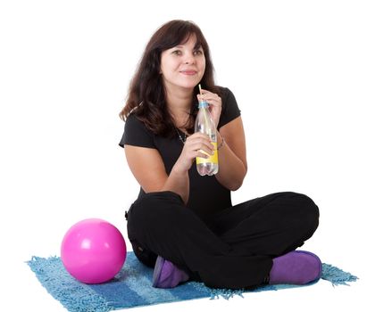 Happy girl drinks water from a bottle. Isolated on white background