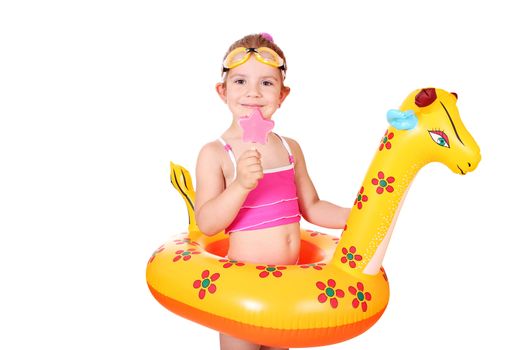 little girl with ice cream and swimming rubber ready for beach