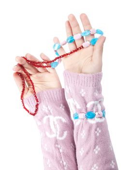 The hands of girls showing glass ornaments isolated on white with clipping path