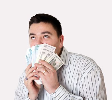 Happy young man won a large sum of money. Isolated on gray with a clipping path.