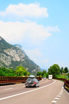 Traffic On a Modern Highway In The Italian Alps