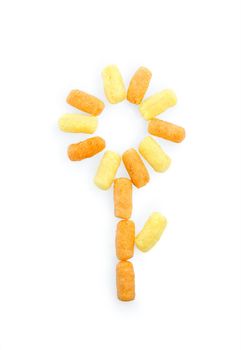 Flower of colored corn sticks on a white background