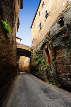 Narrow Alley With Old Buildings In Italian  Medieval City 