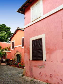 Italian Medieval Courtyard Decorated With Flowers Geranium