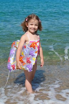 happy little girl with airbed