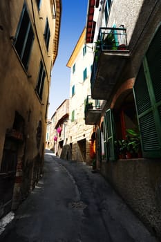 Narrow Alley With Old Buildings In Italian City 