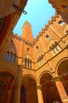 Looking Up In Courtyard Of Palazzo Pubblico To The Torre Del Mangia