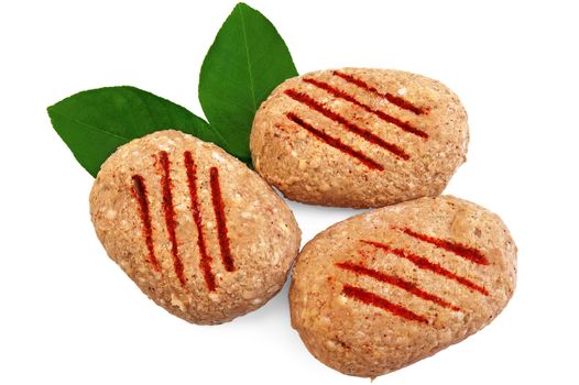 Three frozen meat patties, two green leaf lemon isolated on a white background