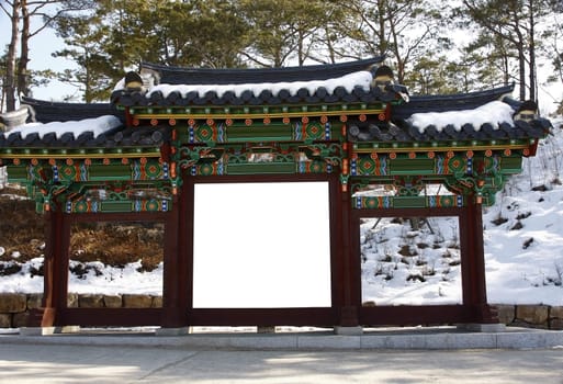 Blank billboard on a korean gate temple during winter-put your text on white.