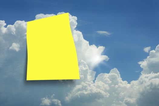 Yellow paper in a blue sky background