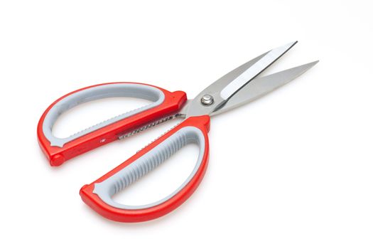 Red scissors isolated on white background