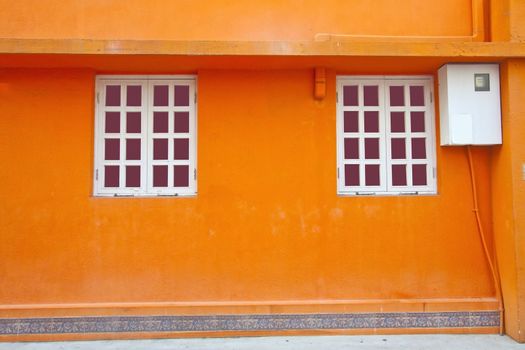 Vintage wall and windows in orange background
