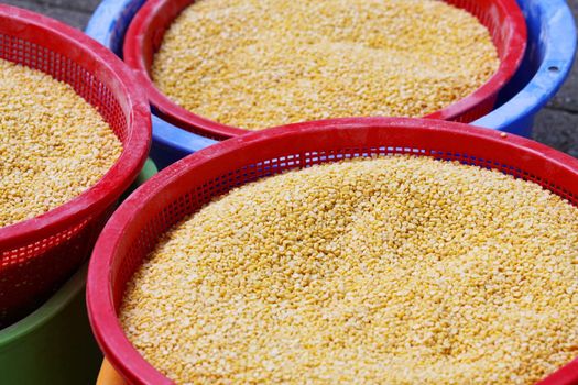 Yellow beans in baskets for sale in market