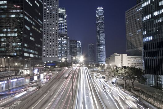 Traffic in Hong Kong downtown at night, low saturation image.