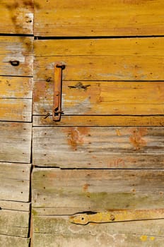 Rural background of an old farm building door.